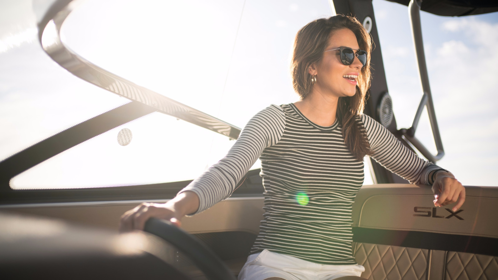 Guest at the helm of the Sea Ray